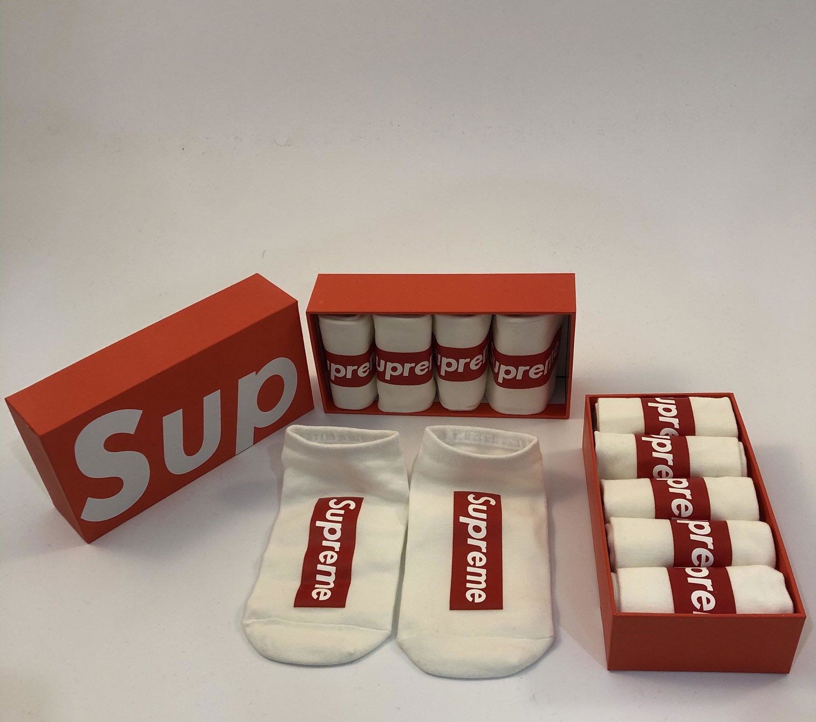 Supreme Socks: SUPREME Socks issued by Supreme with box Total of 10 pairs in white.