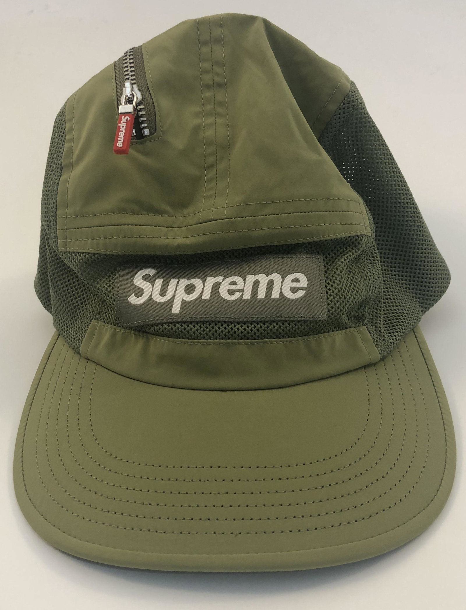 Supreme Zip Mesh Camping Hat: SUPREME Green zip mesh camping hat with white logo issued by Supreme.