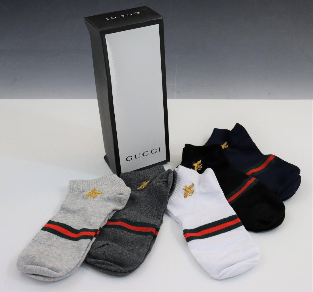 Grouping of 5 Pairs Gucci Socks: GUCCI (ITALIAN) Grouping of socks (5 pairs) issued by Gucci with box