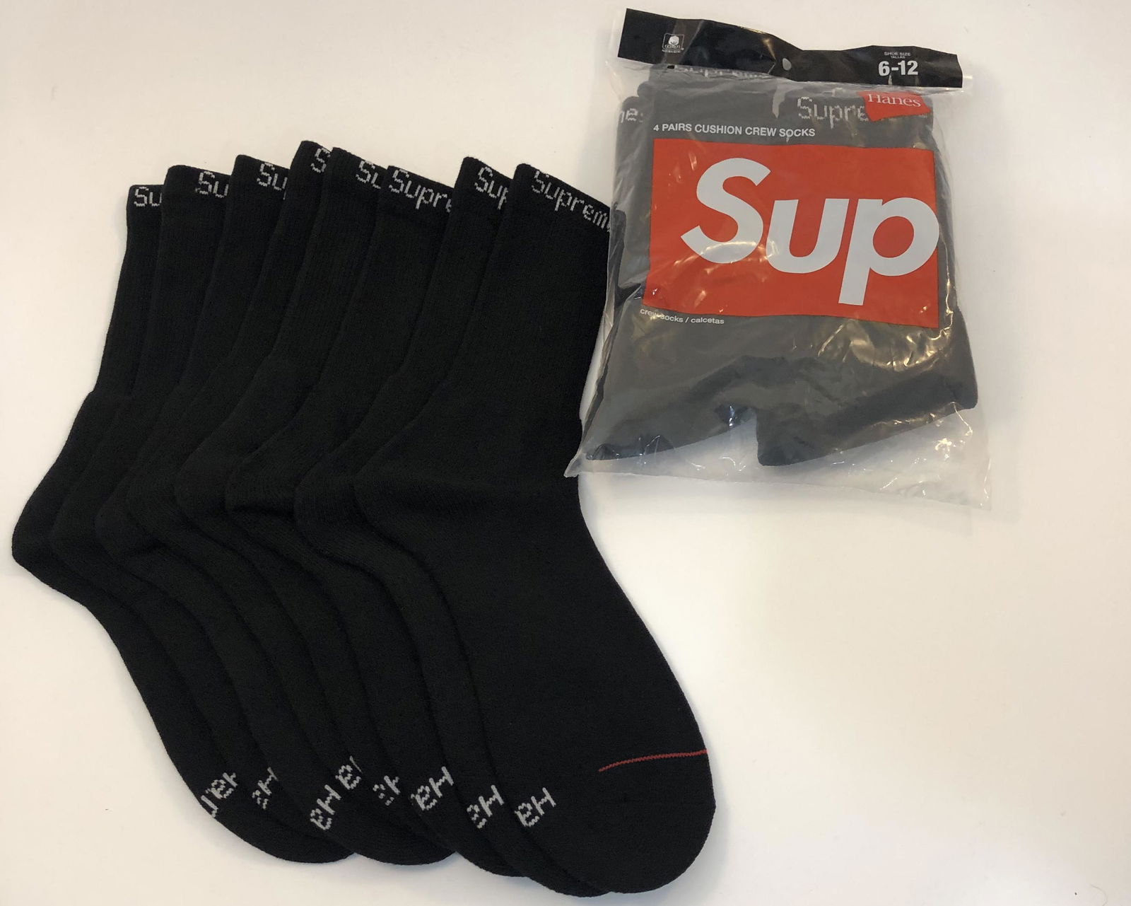Supreme Cushion Crew Socks: SUPREME Cushion Crew Socks issued by Supreme Total of 8 pairs in black.