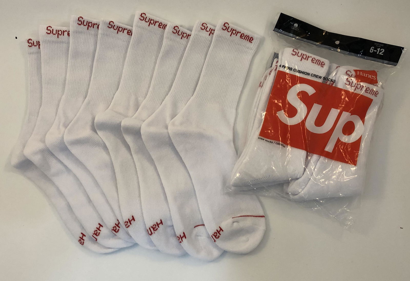 Supreme Cushion Crew Socks: SUPREME Cushion Crew Socks issued by Supreme Total of 8 pairs in white.