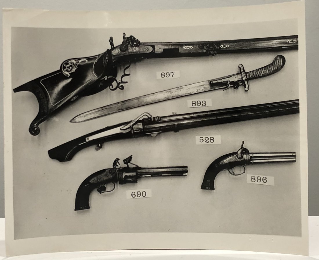 Andy Warhol (Guns) Estate Stamped Photograph: ANDY WARHOL (1928-1987) Guns Photograph 8" x 9 3/4" Embossed to lower side Stamped to verso "Authenticated - The Estate of Andy Warhol"