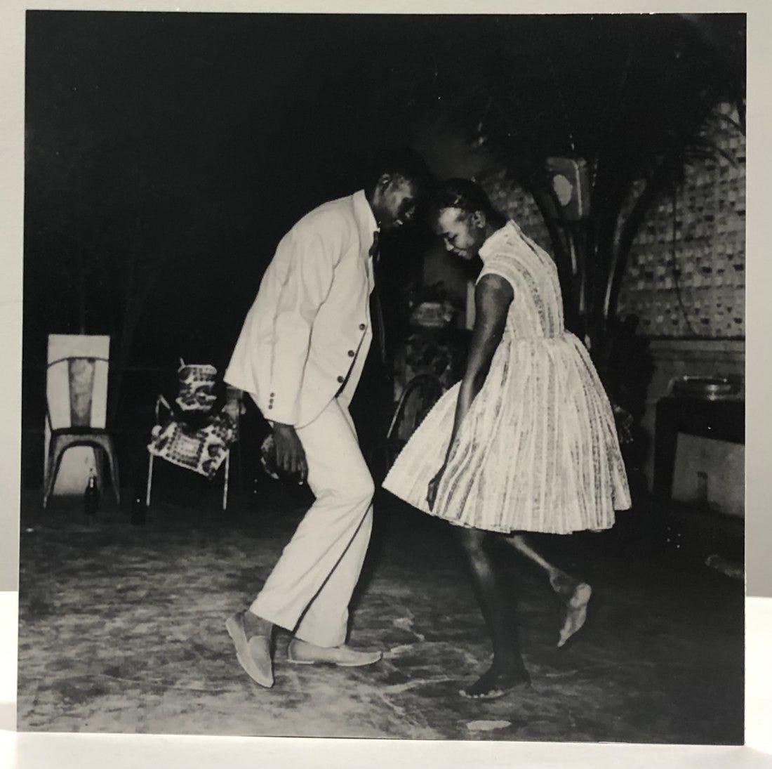 Malick Sidibe (Christmas Eve, Happy Club) Photograph: MALICK SIDIBE (1935-2016) Christmas Eve, Happy Club, 1963 Photograph, printed later 6" x 6" Mounted to same sized cardstock