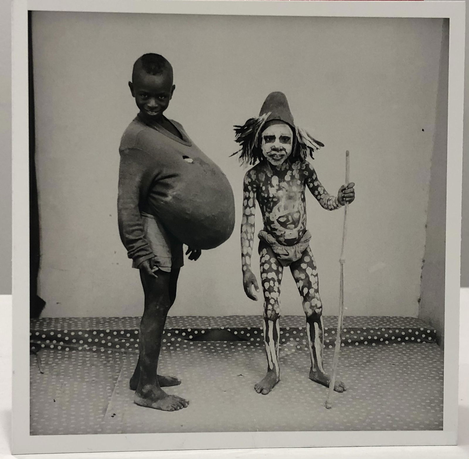 Malick Sidibe (Two Children) Glossy Photo-Litho: MALICK SIDIBE (1935-2016) Two Children Glossy photo-litho Printed circa later 20th c. 6 3/4" x 6 3/4" Mounted to same sized cardstock