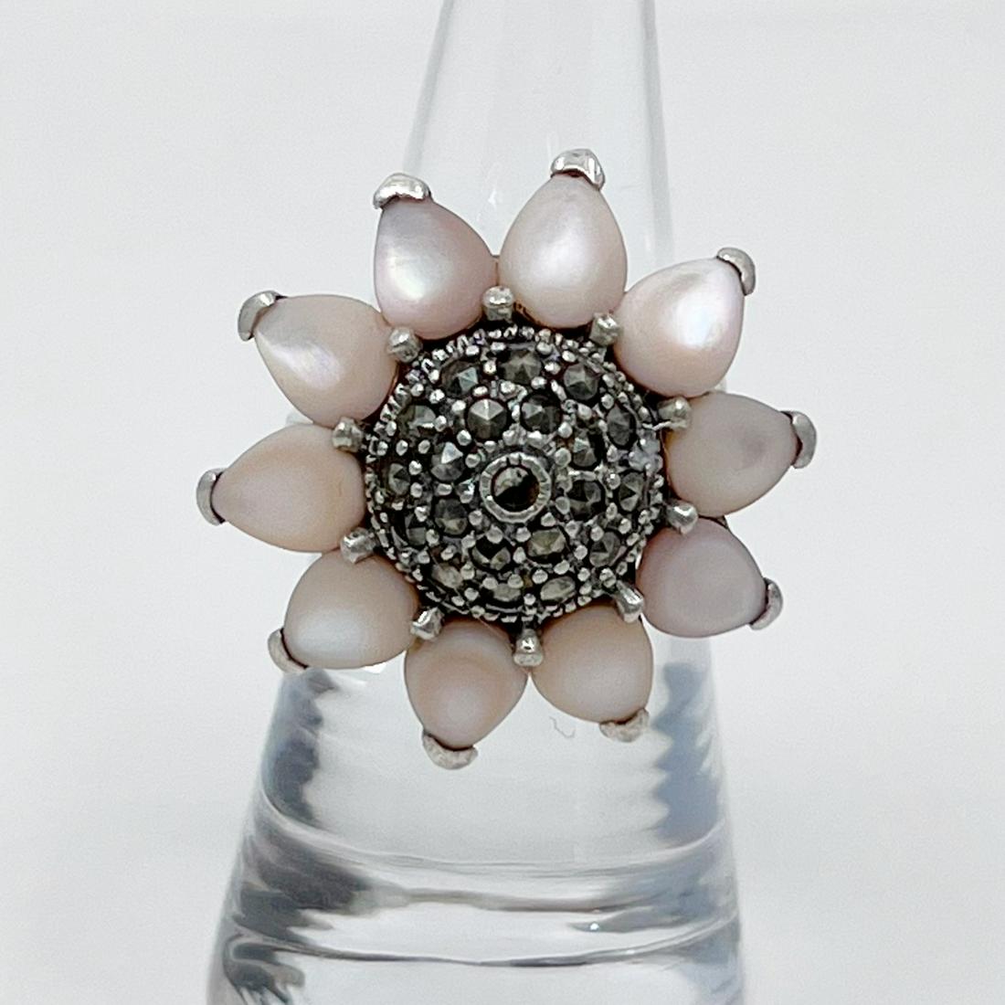 sterling silver mother pearl & marcasite ring: Measurements: 1" wide Gemstone: mother pearl & marcasite Size: 6 1/2 Mate