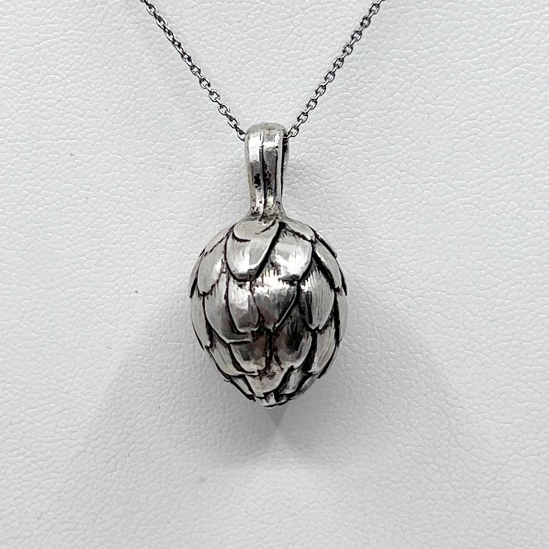 Vintage silver plated artichoke pendant: Measures: 1 1/4" long by 5/8" wide Material: silver plated In like new pre-owned condition