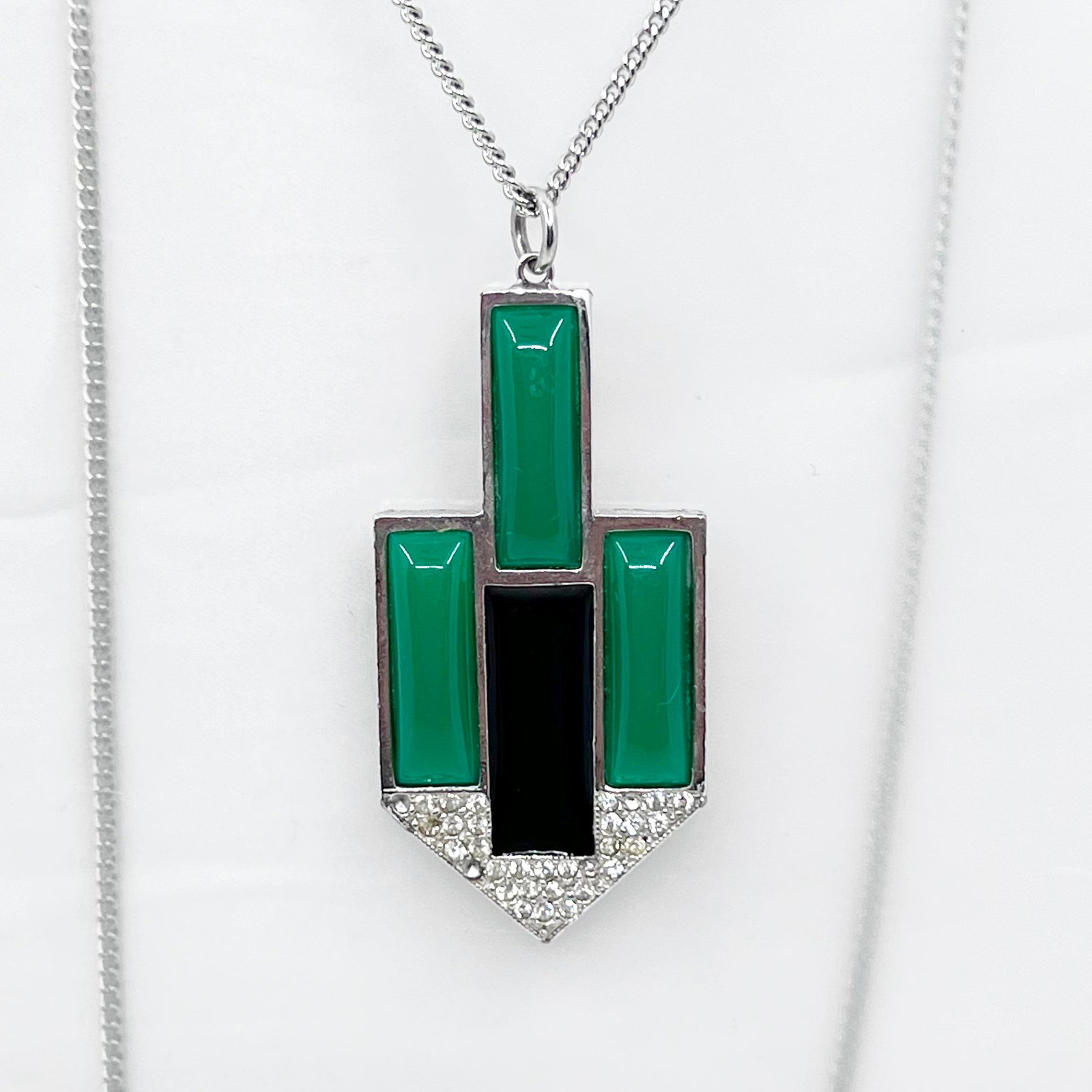 KENNETH LANE Jade & Rhinestone Necklace: Chain: 28” long Pendant: 2 1/2” long by 1 1/8” wide Crafted with rhinestones & faux jade In good condition Note: missing
