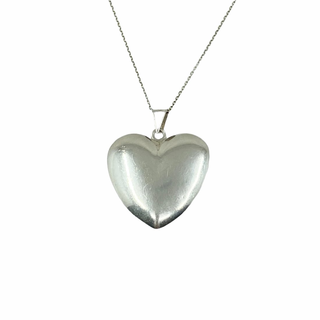 sterling silver hollow heart pendant: Measures: 1 5/8" Long x 1 1/8" Wide Material: sterling silver Signed: 925 Condition: good