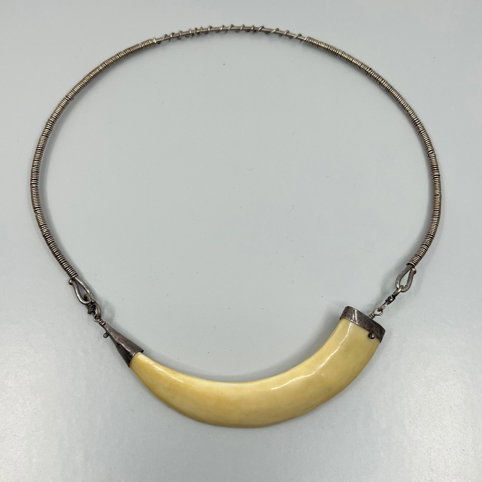 Tribal sterling silver boar tusk necklace: Measures: 20" Long Crafted with 6" long by 3/4" wide boar tusk Condition: Like New SKU-162