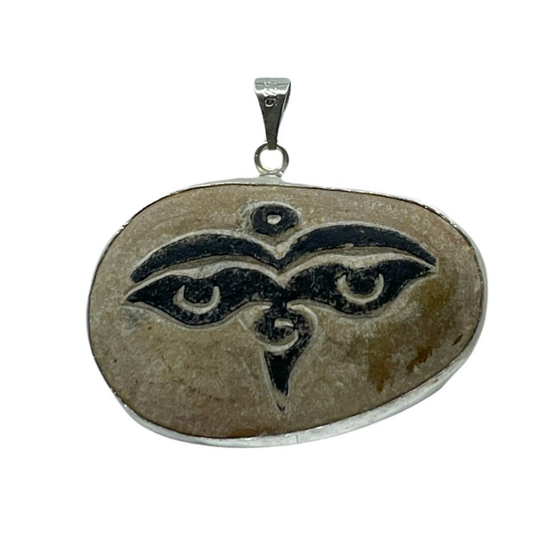 Tibetan sterling silver carved river stone buddha eye pendant: Measurements: 1 3/4" long by 1 7/8" wide Material: sterling silver Gemstone: river stone condition: like new SKU-440