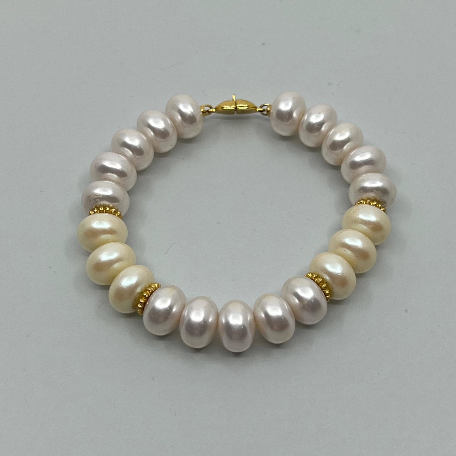 Monet Pearl gold tone bracelet: bracelet will fit up to 7 1/4" wrist crafted with faux pearl Condition: like New SKU-5078