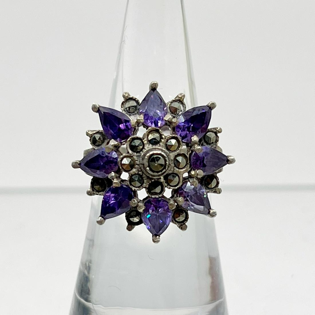 Sterling silver amethyst & marcasite ring: Measurements: 7/8" Wide Size: 5 3/4 Gemstone: amethyst & marcasite Material: sterling silver Signed: 925 Condition: like new SKU-330