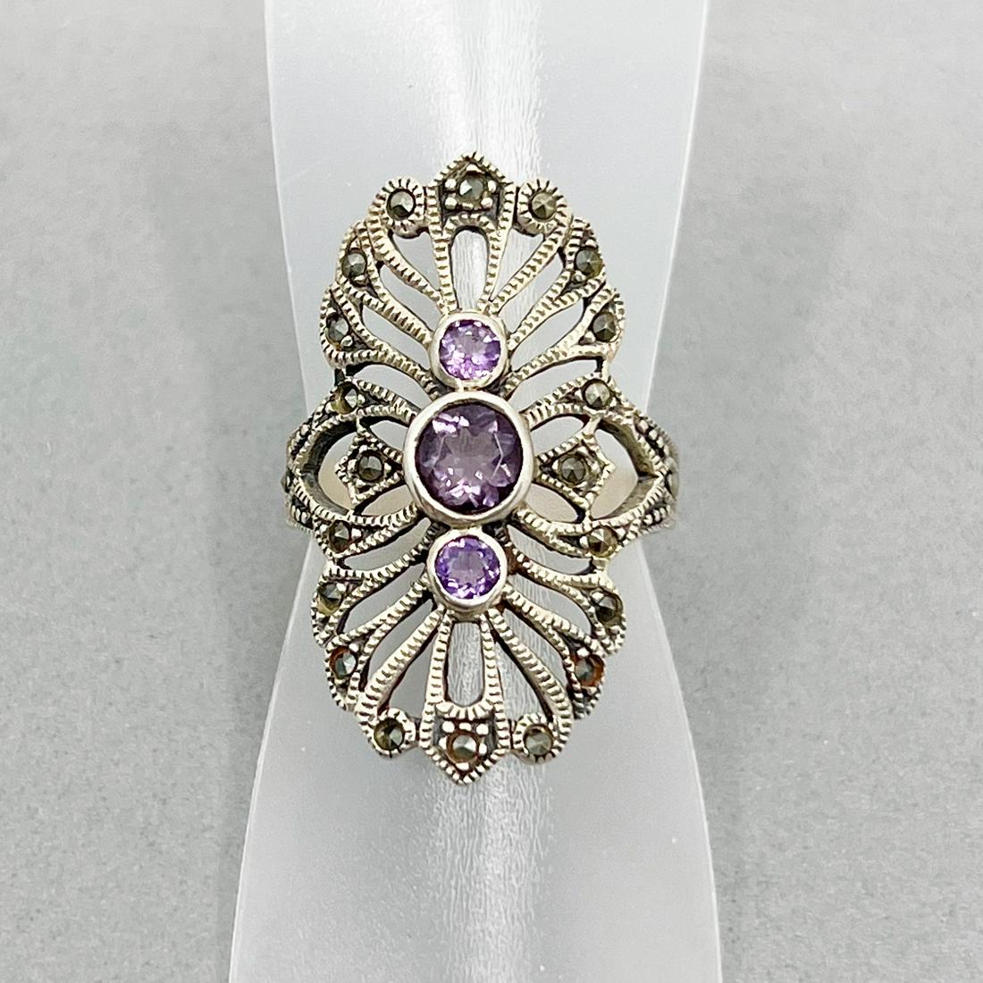 sterling silver marcasite & amethyst ring: Measures: 1 3/16" wide size: 6 Crafted with amethyst & marcasites Condition: like new SKU1106
