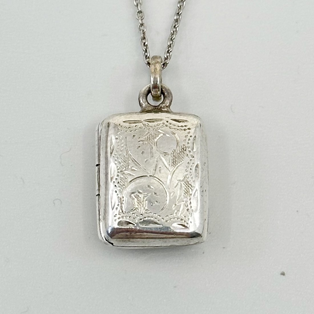 Sterling silver locket pendant: Measures: 7/8" Long by 1/2" Wide Material: sterling silver Signed: 925 Condition: like new SKU-1199
