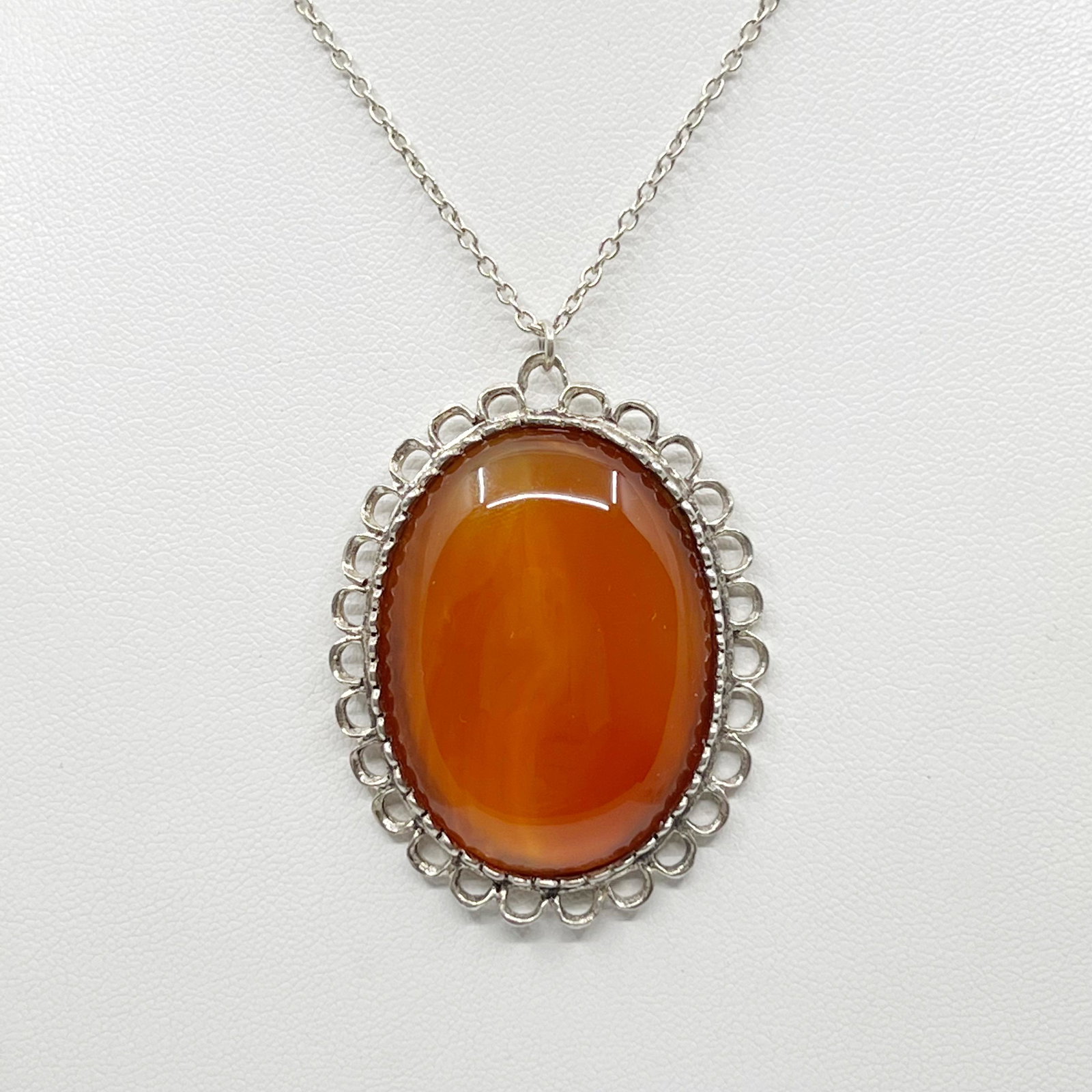 British sterling silver carnelian necklace: Chain: 24" long Pendant: 2 1/8" long by 1 1/2" wide Crafted with 40x30mm carnelian Condition: like new SKU-1362