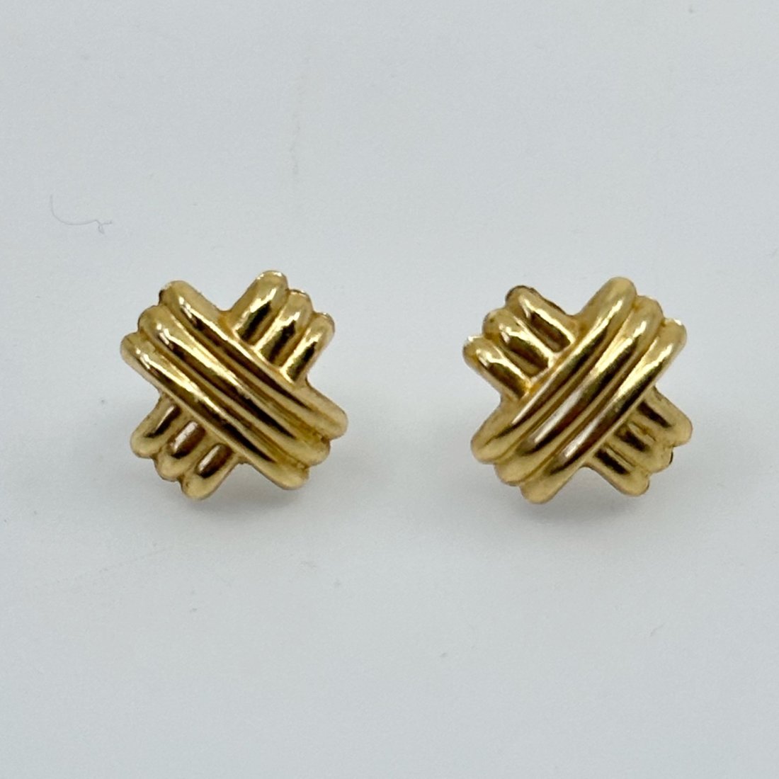 14k yellow gold double crisscross stud earrings: measures: 10mm long condition: like new Note: ear backs are 10k SKU-31