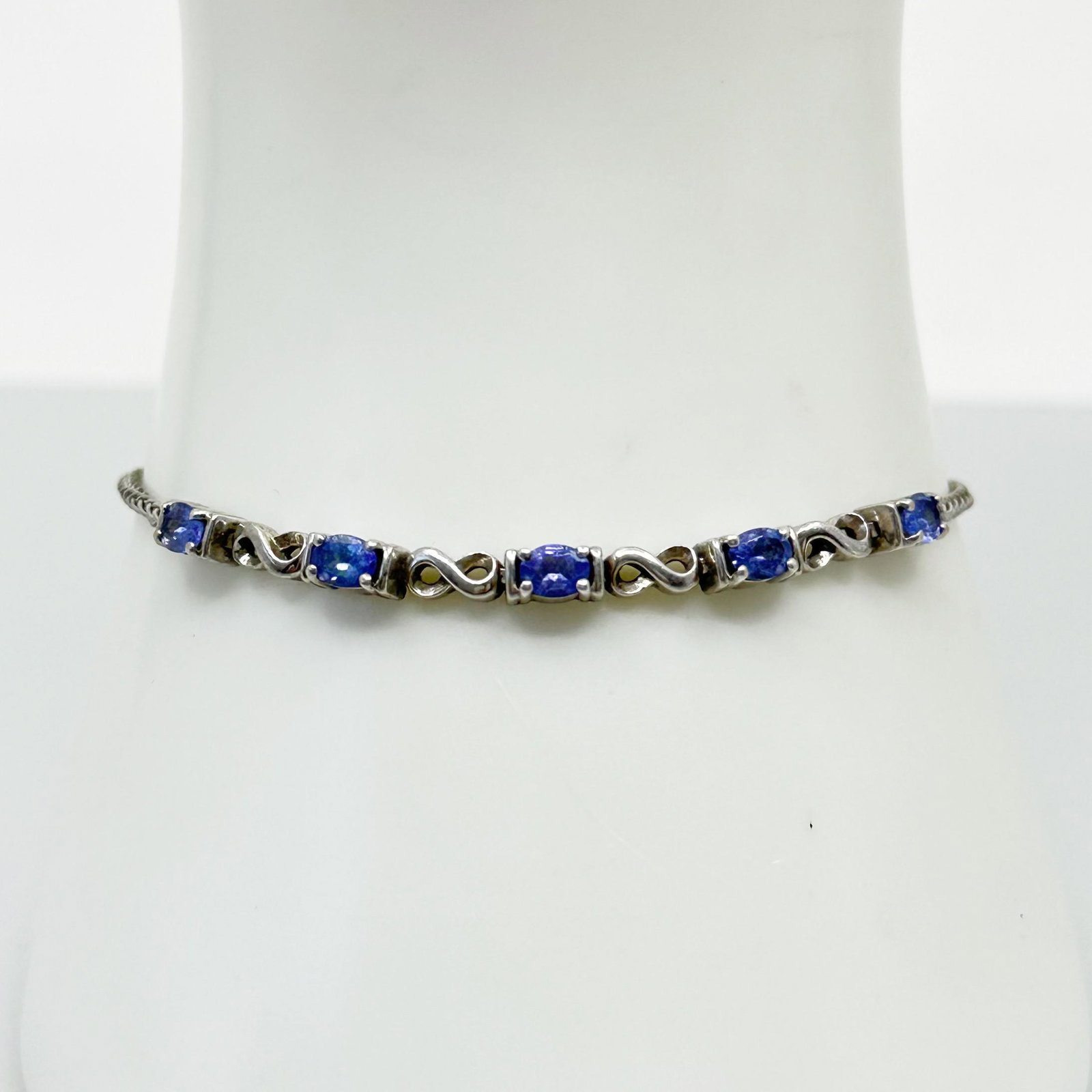 SK Sterling silver iolite slide bracelet: bracelet will fit up to 7 1/2" wrist by 3mm wide Gemtones: iolite Hallmark: sterling SK Condition: like new SKU-581