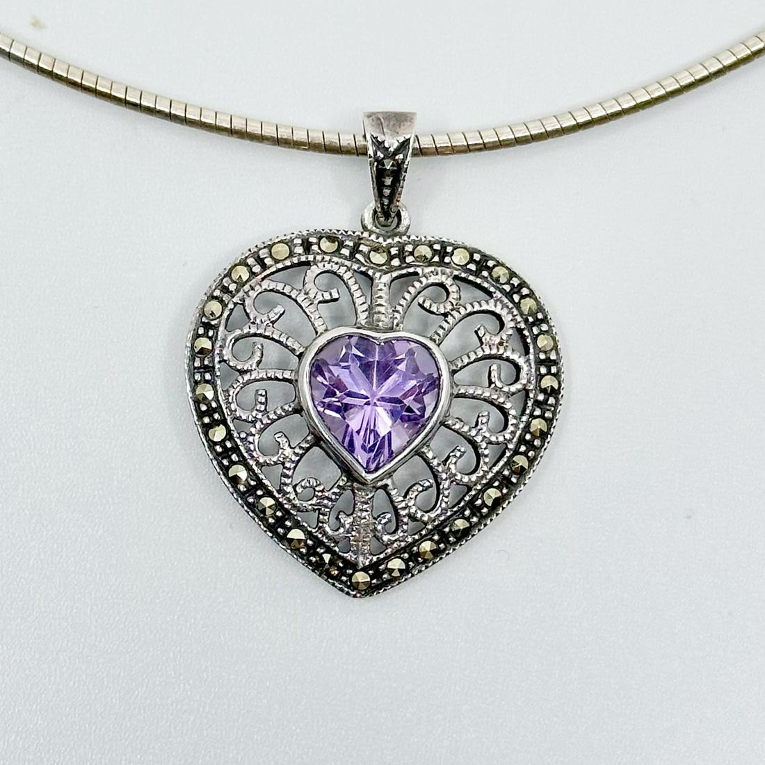 Sterling silver amethyst & marcasite pendant: Measures: 1 1/4" Long by 1" Wide Crafted with 9x9mm amethyst & marcasite Condition: Like New SKU-590