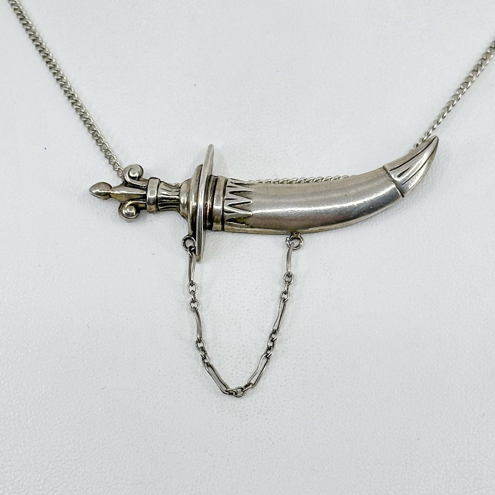 Vintage Sterling silver Khanjar dagger pendant: measures: 2 3/8" long by 7/8" wide Signed sterling In very good condition SKU-