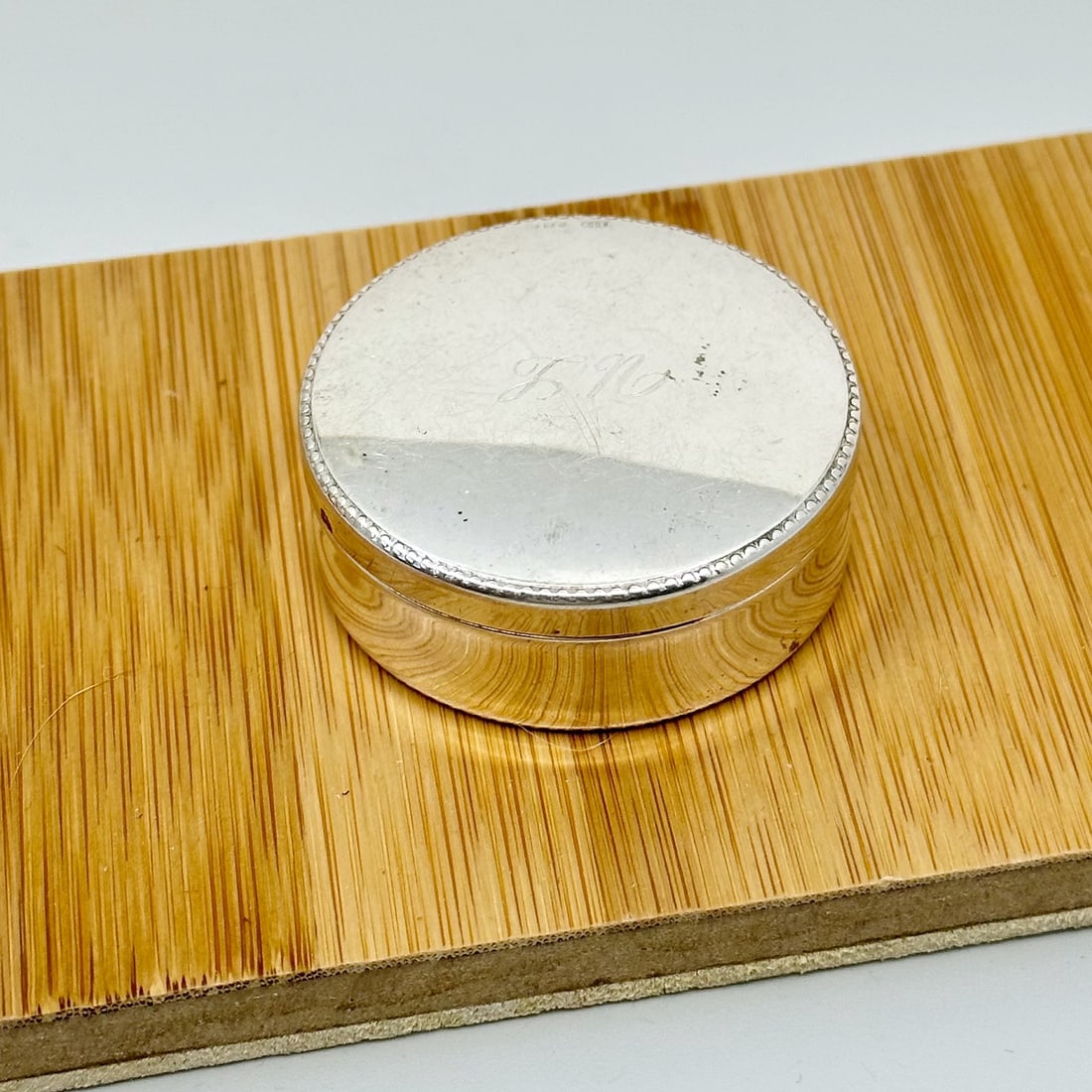 Italian 800 silver pill box: Measures: 1 7/8" wide by 3/4"wide Hallmark: 800 29pd Engraved with LN initials Condition: Good SKU-759