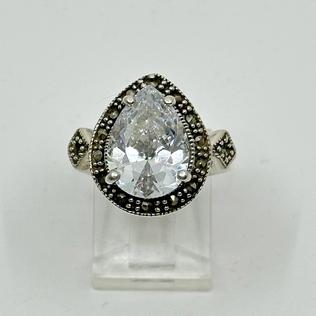 Sterling silver marcasite & cubic Zirconia Ring: Measurements: 5/8" Wide Size: 5 1/2 Crafted with 14x10mm Cubic zirconia & marcasites Material: sterling silver Hallmark: 925 Condition: Like new SKU-852