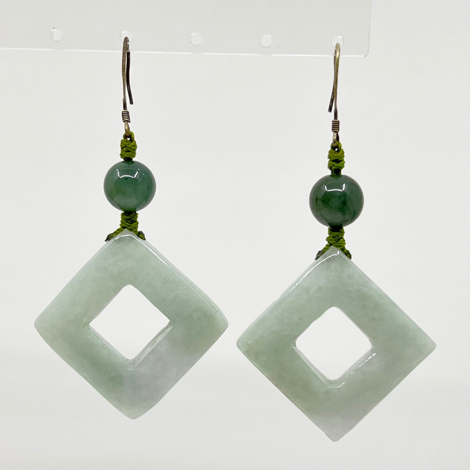 Sterling silver jadeite earrings: Measures: 2 7/8" long by 1 1/2" wide Gemstone: 10mm & 33x33mm jadeite Signed: 925 Condition: like new SKU-913