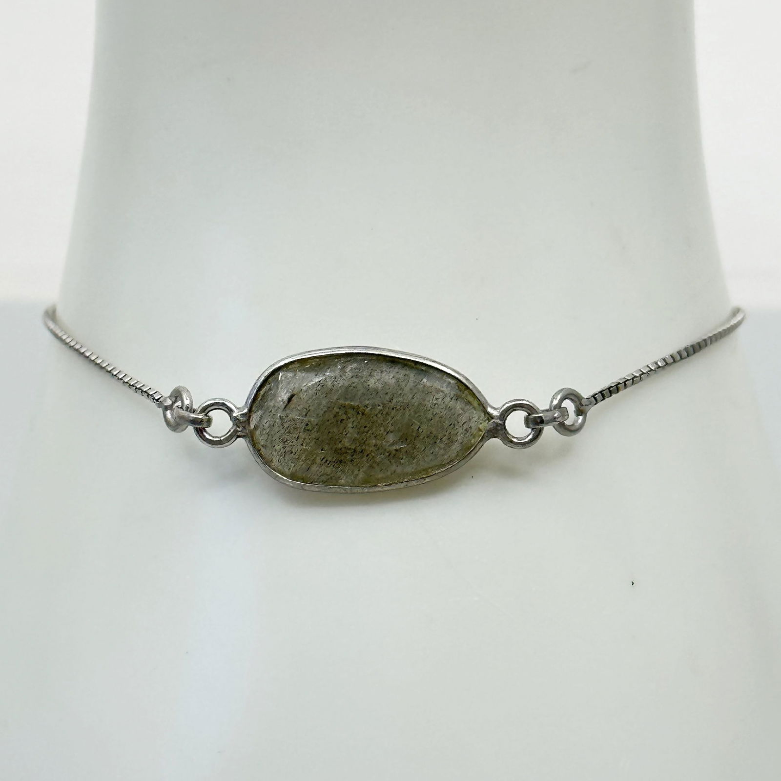 sterling silver labradorite slider bracelet: bracelet will fit up to 7 1/2" wrist by 11mm wide Gemstone: labradorite Condition: like new SKU-1062