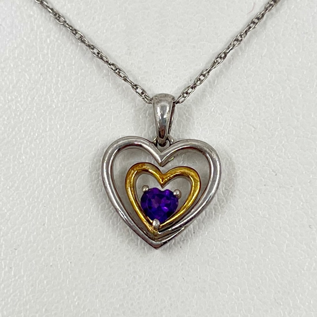 Sterling silver amethyst heart pendant necklace SKU-20: chain: 18" long pendant: 3/4" long by 3/4" wide Gemstone: amethyst In very good condition SKU-20