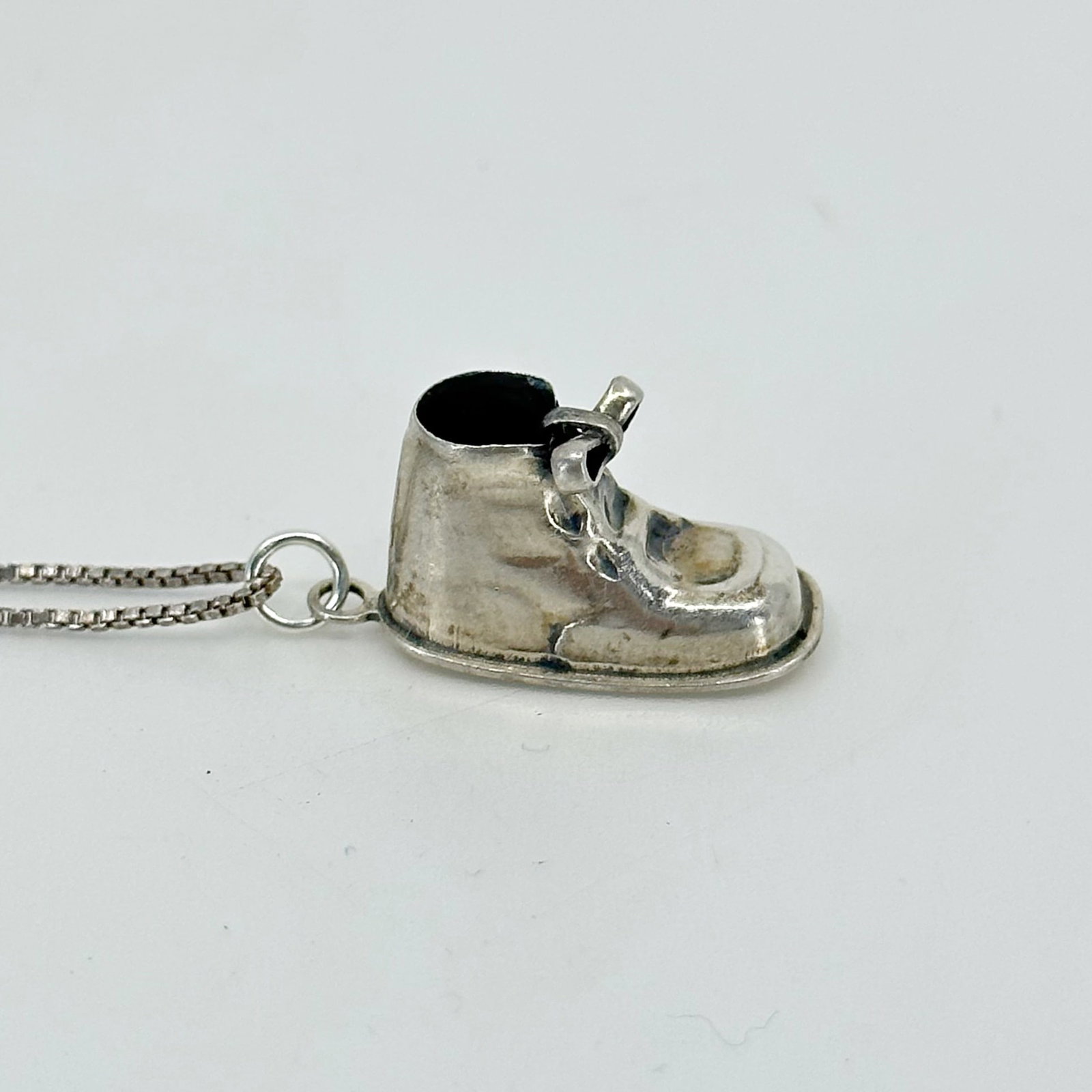 Vintage Sterling silver Kimberly baby shoe charm pendant SKU-358: measures: 1" long by 3/8" wide Hallmark - Sterling In very good condition SKU-358