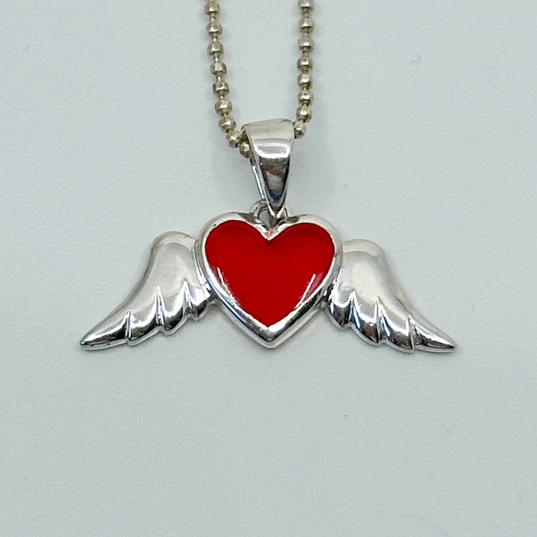 Sterling silver acrylic winged heart pendant SKU-510: Measures: 5/8" long by 1" wide Condition: Like new SKU-510