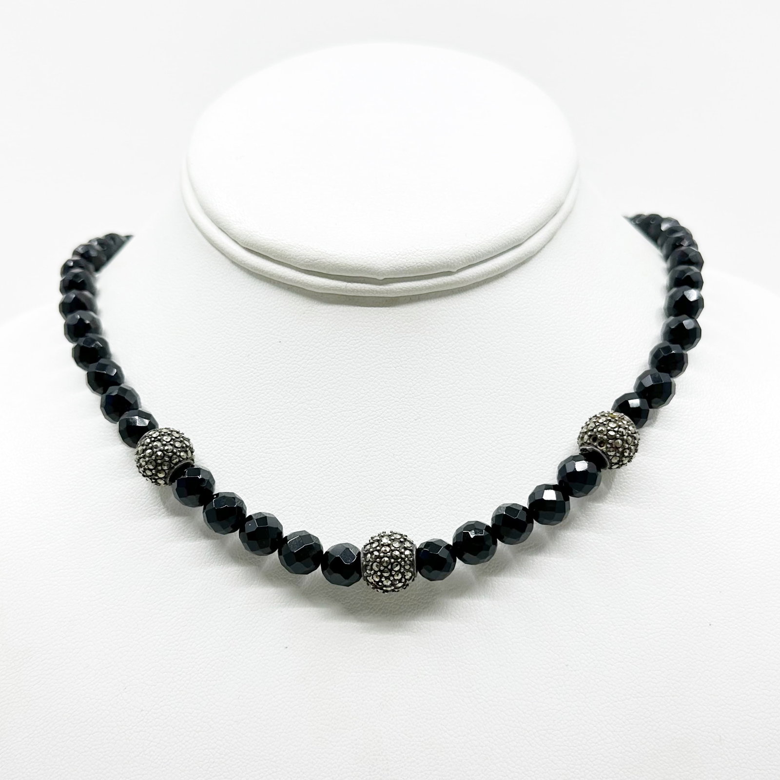 Sterling silver onyx bead & marcasite necklace SKU-586: chain: 17 1/2" long with a 2" long chain extender Crafted with 8mm facetted onyx & 12mm sterling silver with marcasite beads Hallmark: 925 condition: good / missing 6 marcasites SKU-