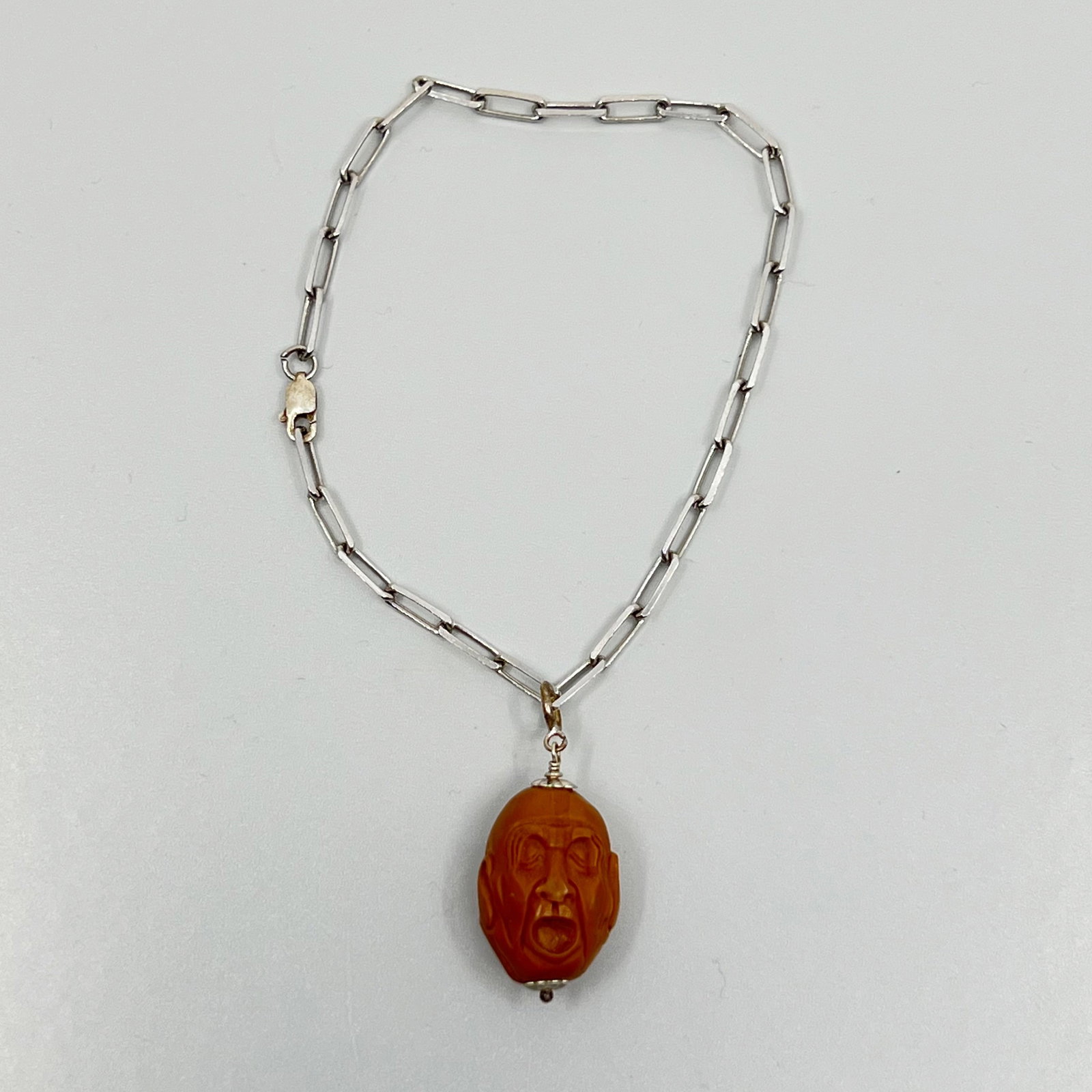 Sterling silver carved olive pit charm bracelet SKU-163: Measures: 7 3/4" long Charm: 1 3/8" long by 5/8" wide Crafted with 21x15mm carved olive pit in very good condition SKU-163