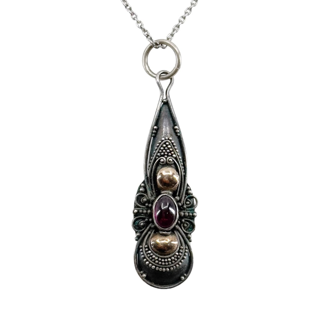 10k gold & Sterling silver garnet pendant SKU-406: Measures: 1 5/8" long by 3/8" wide Crafted with garnet In very good condition