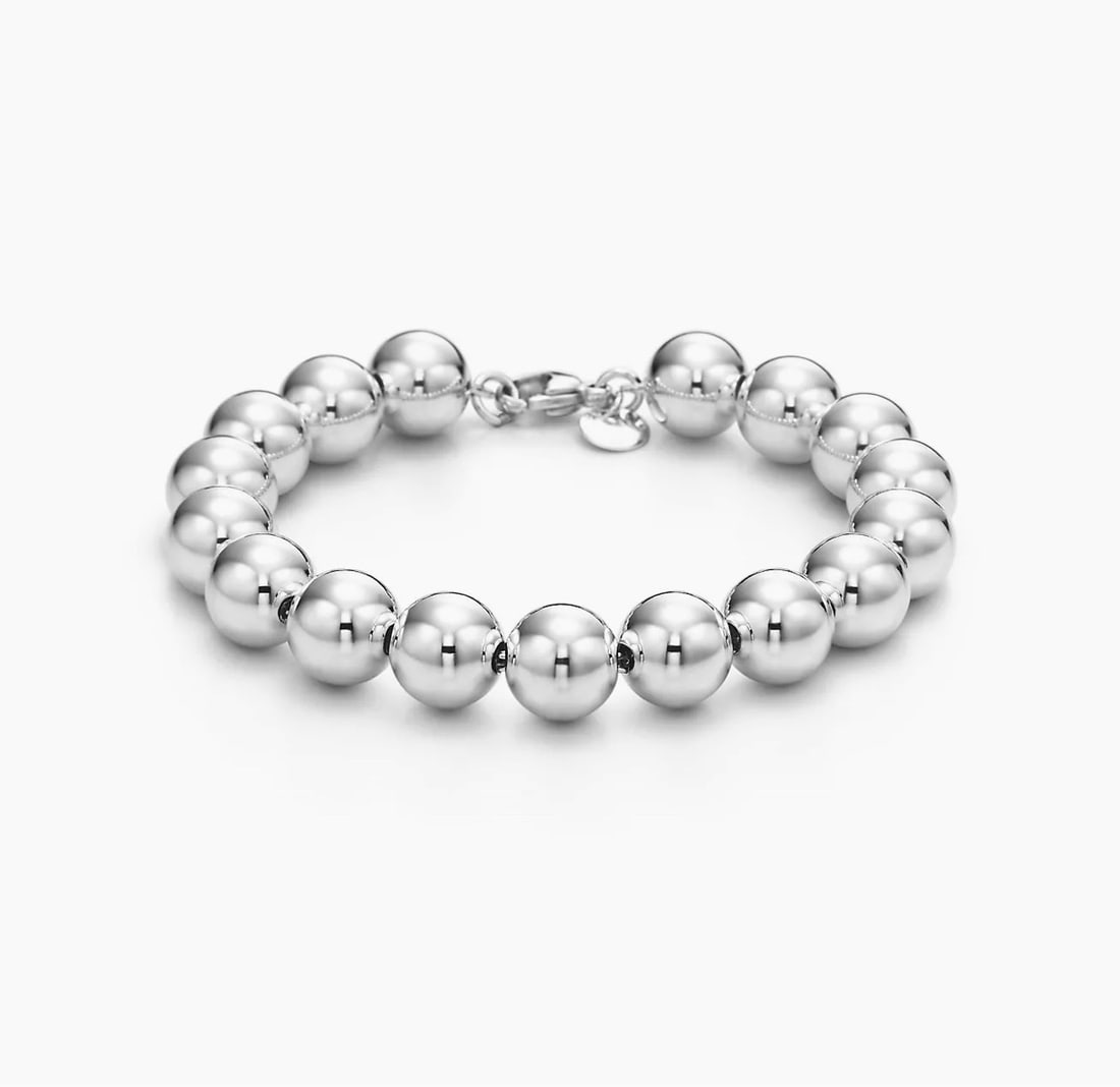 Tiffany & Co sterling silver hardware bead bracelet SKU-1047: The bracelet will fit up to 6 1/4" wrist by 10mm wide Hallmark: 925 Tiffany & Co In very good condition SKU-1047