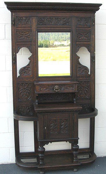 Highly Carved Antique Oak Hall Tree w Mirror: Antique entry hall trees are getting harder and harder to find. This one has plenty of deep carving. 81" tall, 17" deep, 47" at the widest point which is the very top of the piece. There once were two