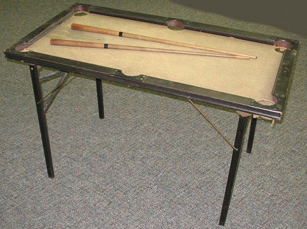 Antique Mini Child's Pool Table w Cue Sticks: Turn-of-the-Century "as found" child size pool table. The frame is in good shape, it needs new felt & ball nets. 42.5" x 27.5" and 25.5" tall.