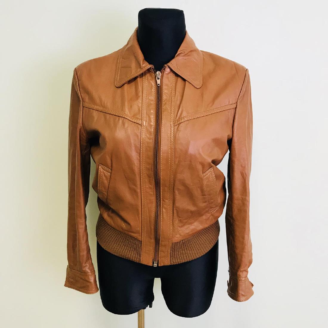 Vintage Women's Leather Bomber Jacket: Size EUR 40 US 10 Armpit to Armpit: 22 in. Sleeve from shoulder seam: 23.5 in. Shoulder to shoulder: 18 in. Total length: 24 in.