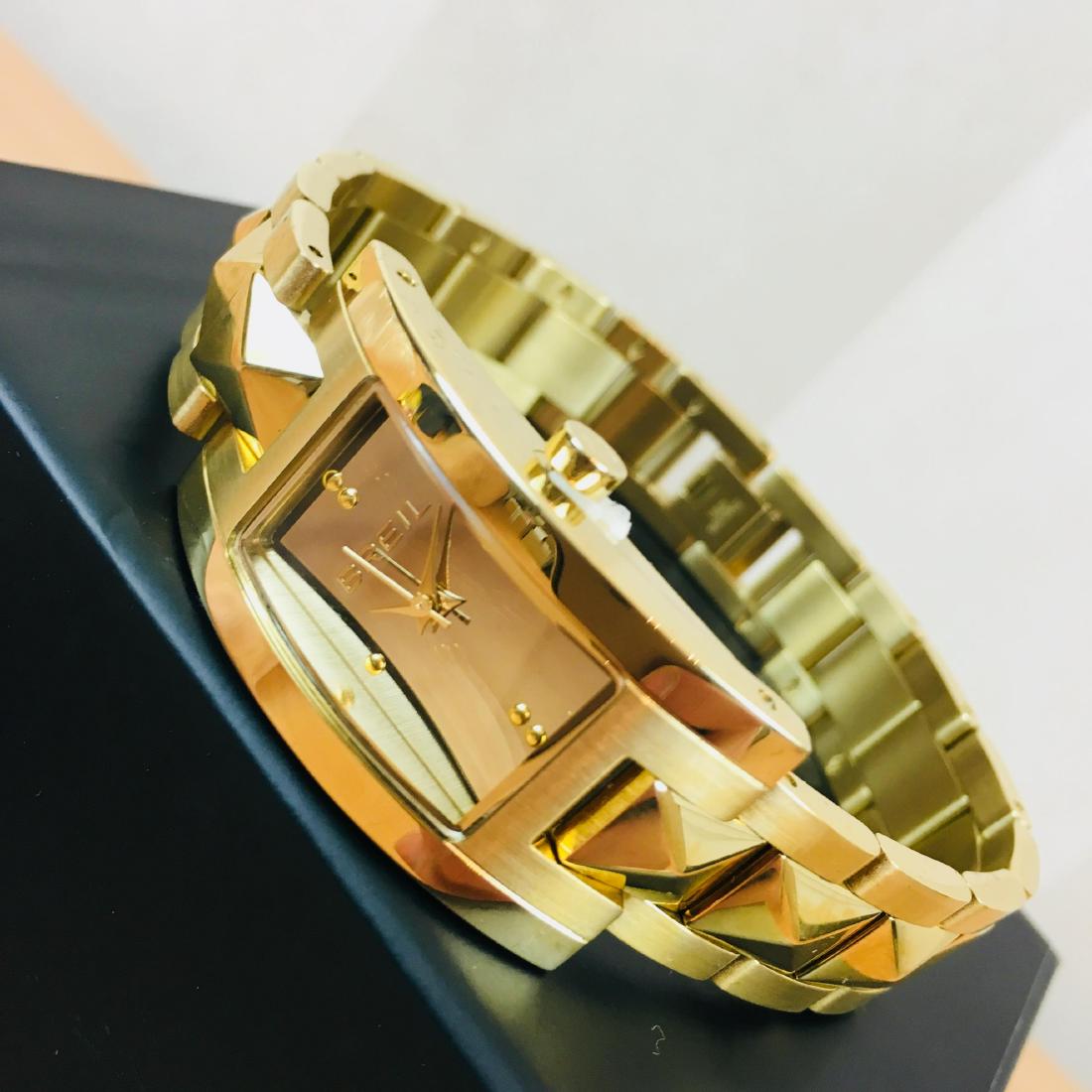 BREIL Italian Ladies Kate Gold Plated Watch: Movement Brand - Miyota Water resistant - 3 Bar Colour of the dial - Silver Hand colors (h,m,s) - Gold, Gold, Gold Case Diameter: 20 mm