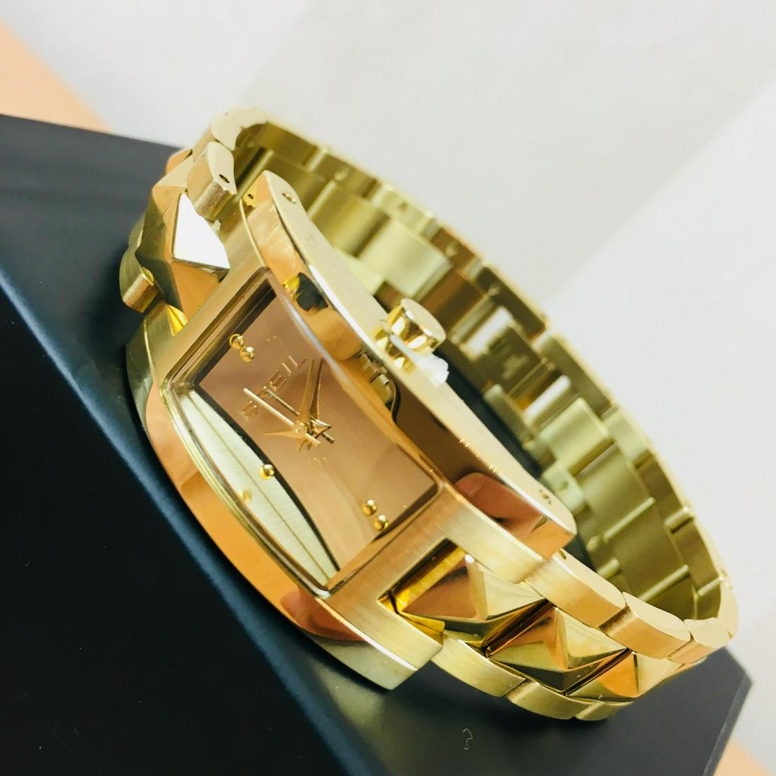 BREIL Italian Ladies Kate Gold Plated Watch: Movement Brand - Miyota Water resistant - 3 Bar Colour of the dial - Silver Hand colors (h,m,s) - Gold, Gold, Gold Case Diameter: 20 mm