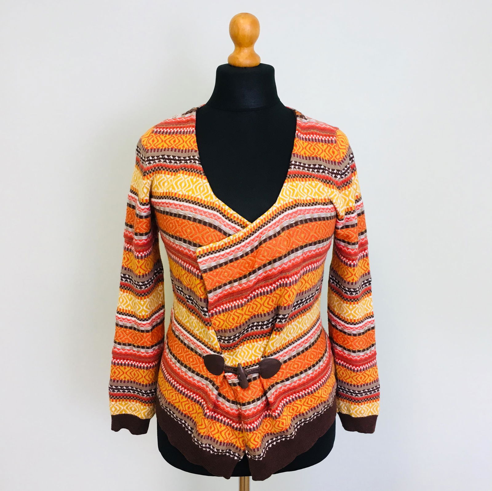 Vintage Women's Gina Sweater Cardigan: Size EUR 40 US 10 55% Cotton 44% Acrylic 1% Metal fibers Armpit to Armpit: 17.5 in. Sleeve from shoulder seam: 23.5 in. Total length: 22 in.