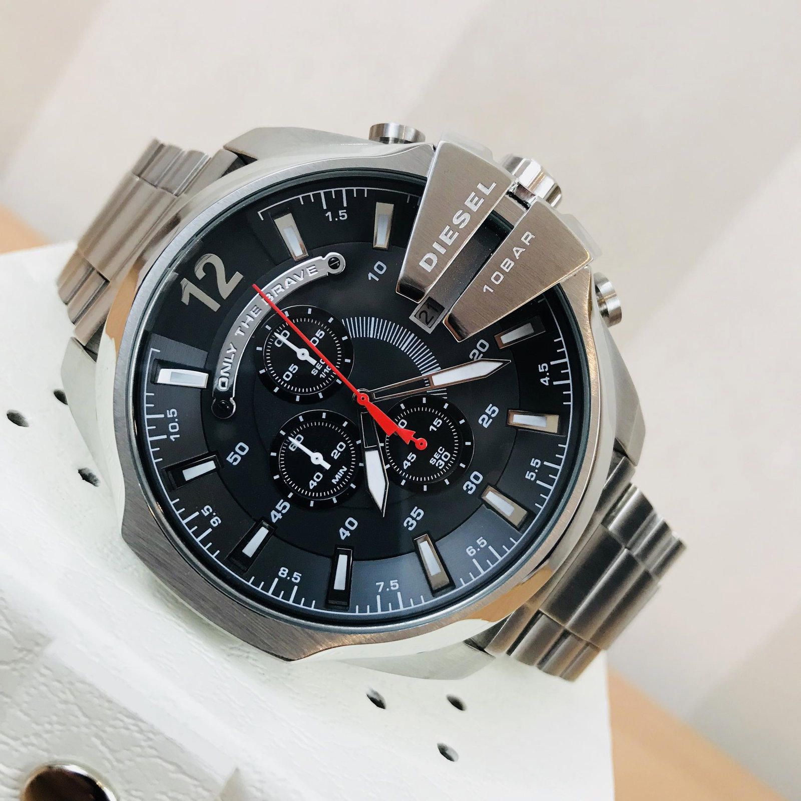 Diesel Men's MEGA CHIEF Stainless Steel Watch: Style #:DZ4308Striking Men's watch from the Mega Chief range by Diesel. It is made from stainless steel and has a large round black dial. This eye-catching piece has silver baton hour markers with hig