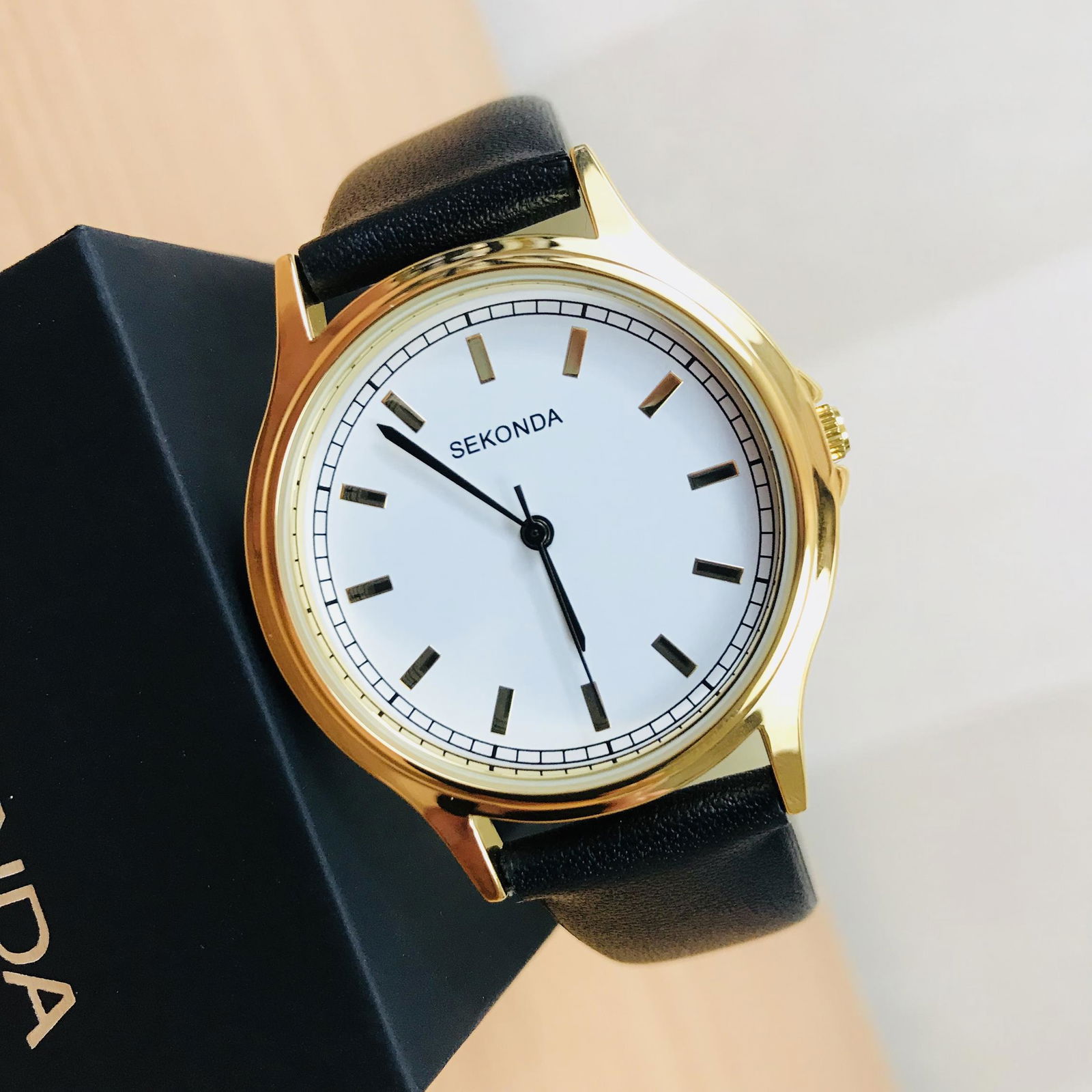 Sekonda Men's Classic Gold Plated Watch: Sekonda men's watch has a round gold plated case with a white color dial. The dial features gold index hour markers, hour, minute and second hands. The black faux leather strap fastens with a buckle.S