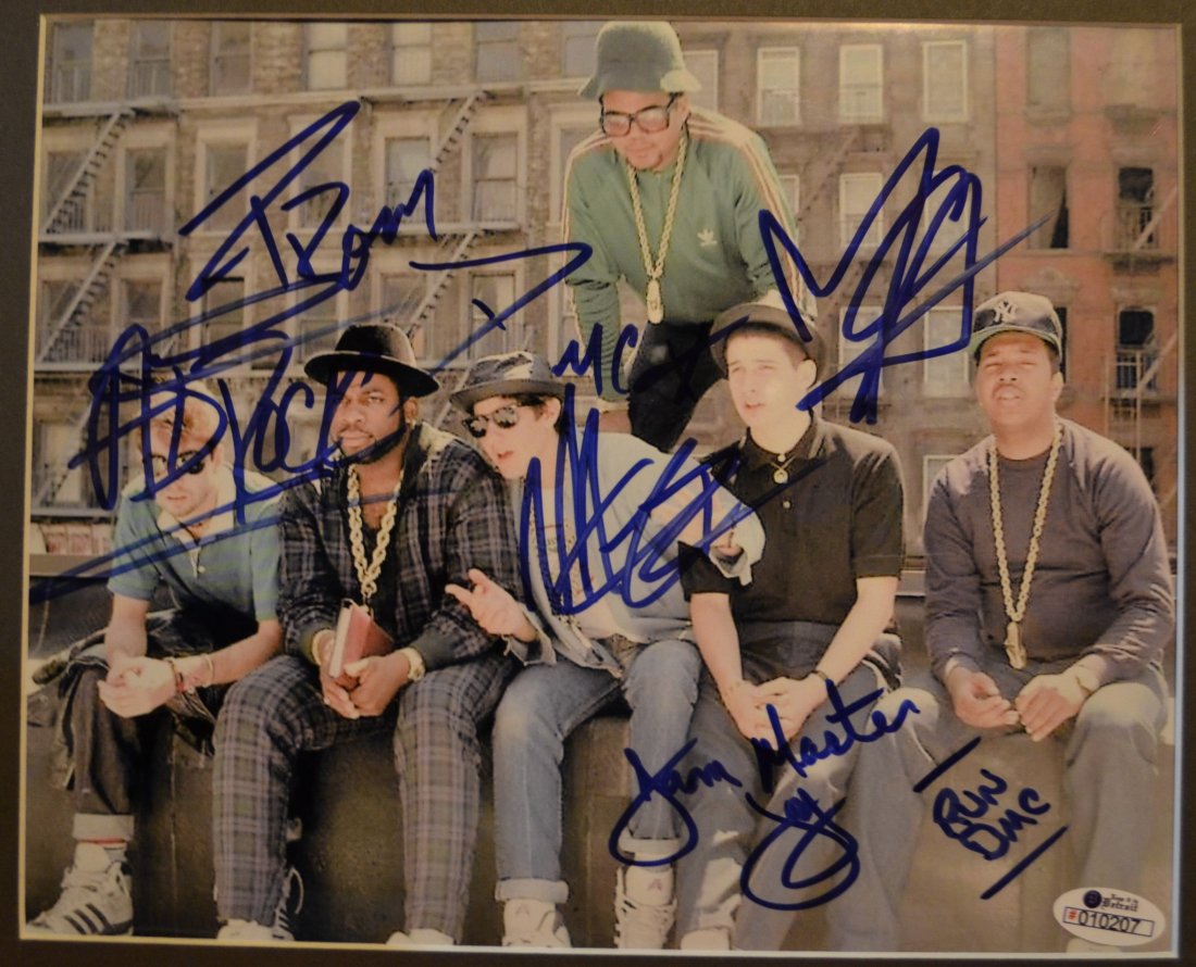 Beastie Boys Run DMC Autograph , Beastie Boys sig: Awesome very rare sign by both this is a very rare very hard to get photo sign by run dmc and the beastie boys they are all here , jam master , mike d , ad rock , mca and the rest very rare never seen