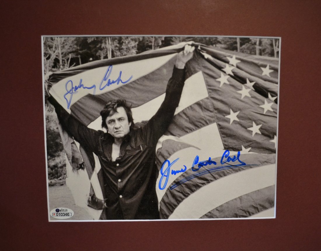 Johnny Cash Autograph Photo , Johnny Cash American Flag: Autograph Rare photo Sign By Johnny Cash and June Carter Cash this beautiful American Flag Photo is awesome and rare ..all items are for charity in Detroit Money for Auction Will Help Detroit Homeless