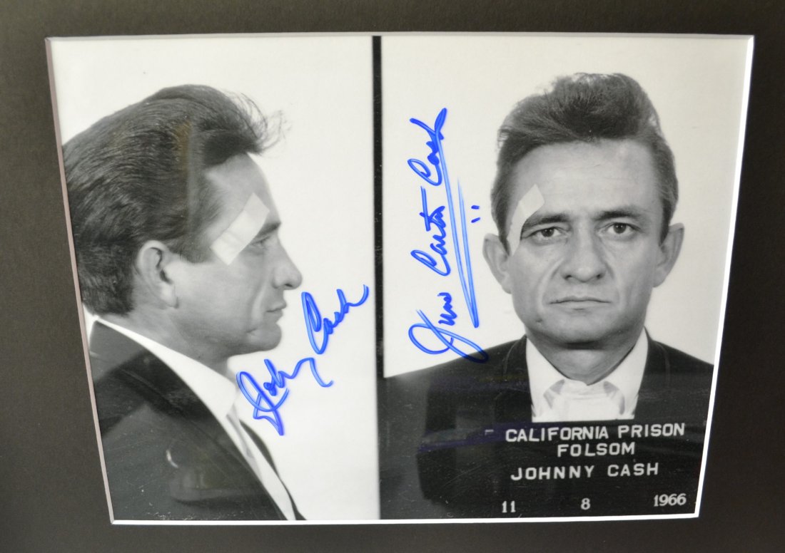 Johnny Cash Autograph Mug shot Photo: Very Rare Autograph , this is a beautiful very tough autograph photo is sign by johnny cash and june carter cash, june used to not like these photos Absolute beautiful sign photo you can not get this