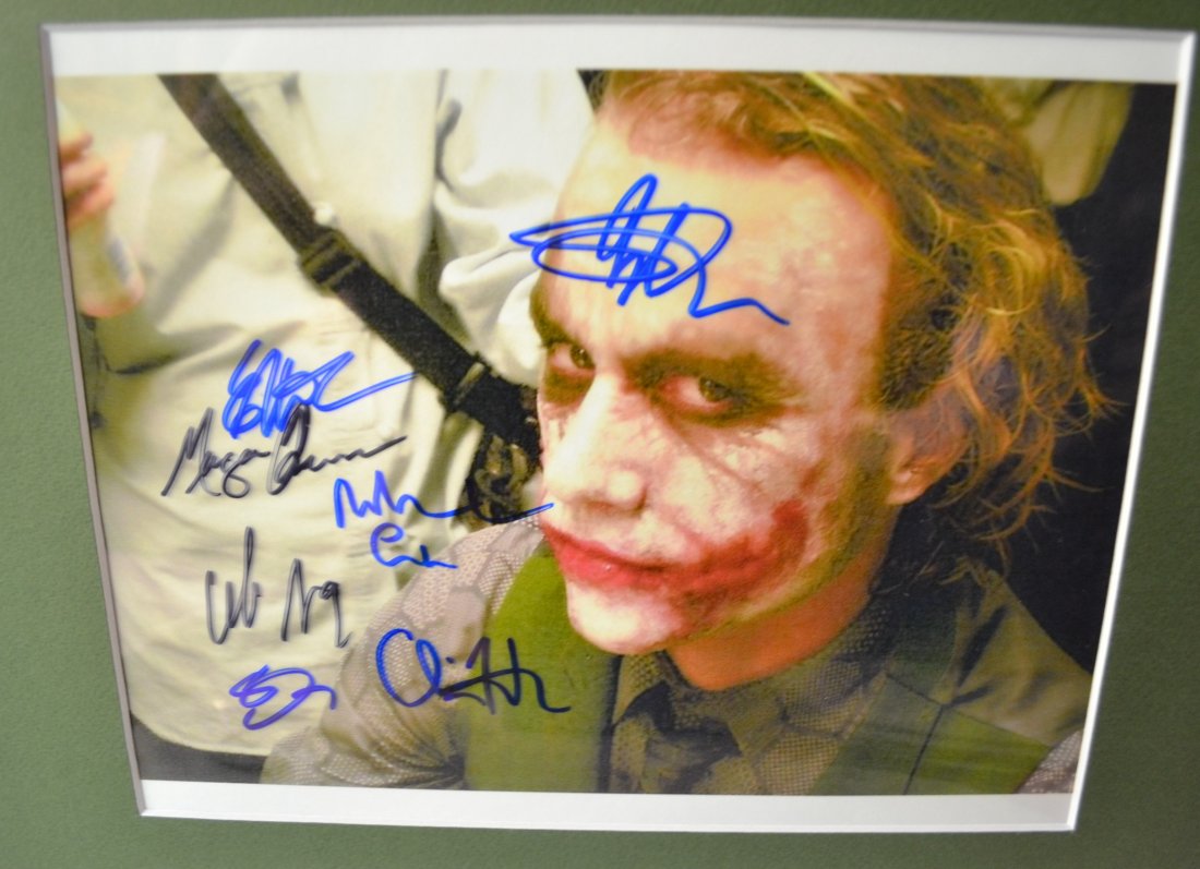 The Joker Heath Ledger Autograph Batman Photo: Very Rare Autograph , this is a beautiful very tough autograph photo is sign by cast, Heath Ledger and others this very rare film promo photo . never seen one sign Absolute beautiful sign photo you ca
