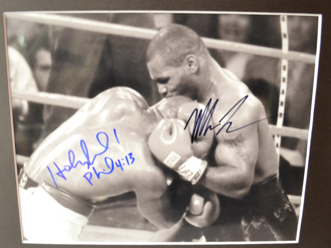 Mike Tyson Bite Ear Photo , Holyfield Autograph: Very Rare Autograph , this is a beautiful very tough autograph photo is sign by Mike Tyson and E Holyfield , Absolute beautiful sign photo you can not get this any longer and a must have all items are