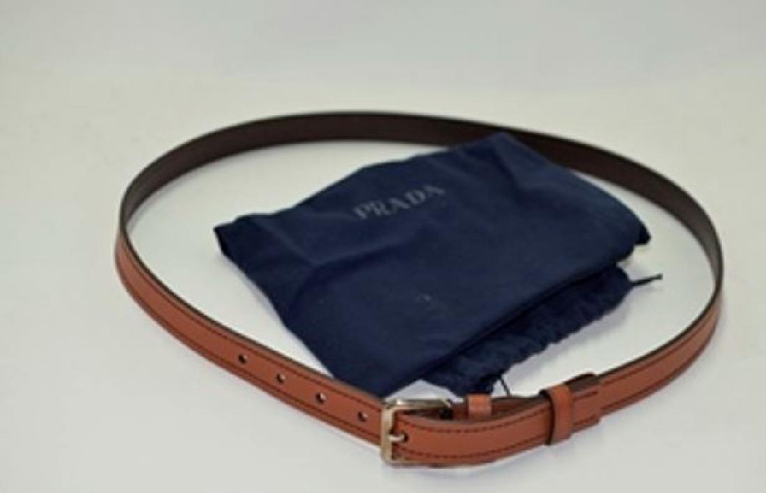 Prada Women's leather Slim Leather with Gold tone: Brand: Prada Style: Vitello Sport Color: Cotto/Cotto Hardware gold toned 100% Leather Made in Italy Size: 95cm/34-35 waist size/37 inches