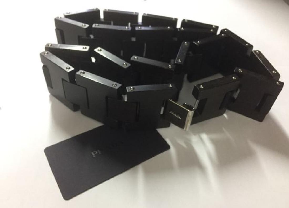 Prada Women's Wooden Belt: Brand: Prada Item: Women's Belt Condition: NEW Made in Italy Materials: 100% Wood Color: Black Hardware: silver-tone clasp/closure Size: 75cm/29.5 inches/waist size 26-27