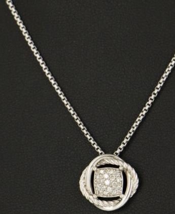 David Yurman Chain/Charm Pendant: David Yurman Sterling Silver/Diamonds chain with pendant Chain Length16" Pendant Length0.50" Width0.50" MaterialSterling Silver Purity925 Weight Grams5.6 DWT3.6 MarkingsD.Y., 925 Stone(s)Diamond Color